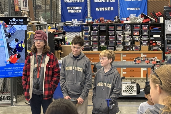 Oakland Christian students stand for a photo at a robotics competition.