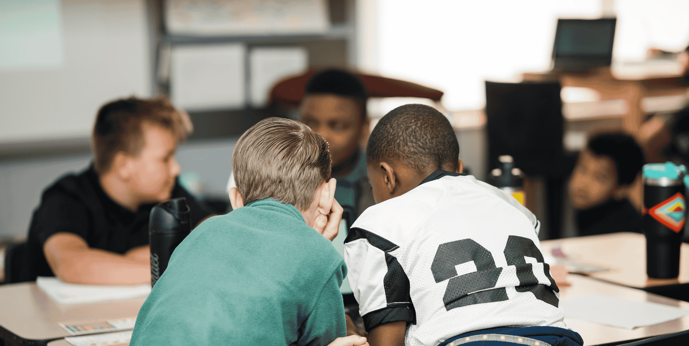 Two elementary boys working in class