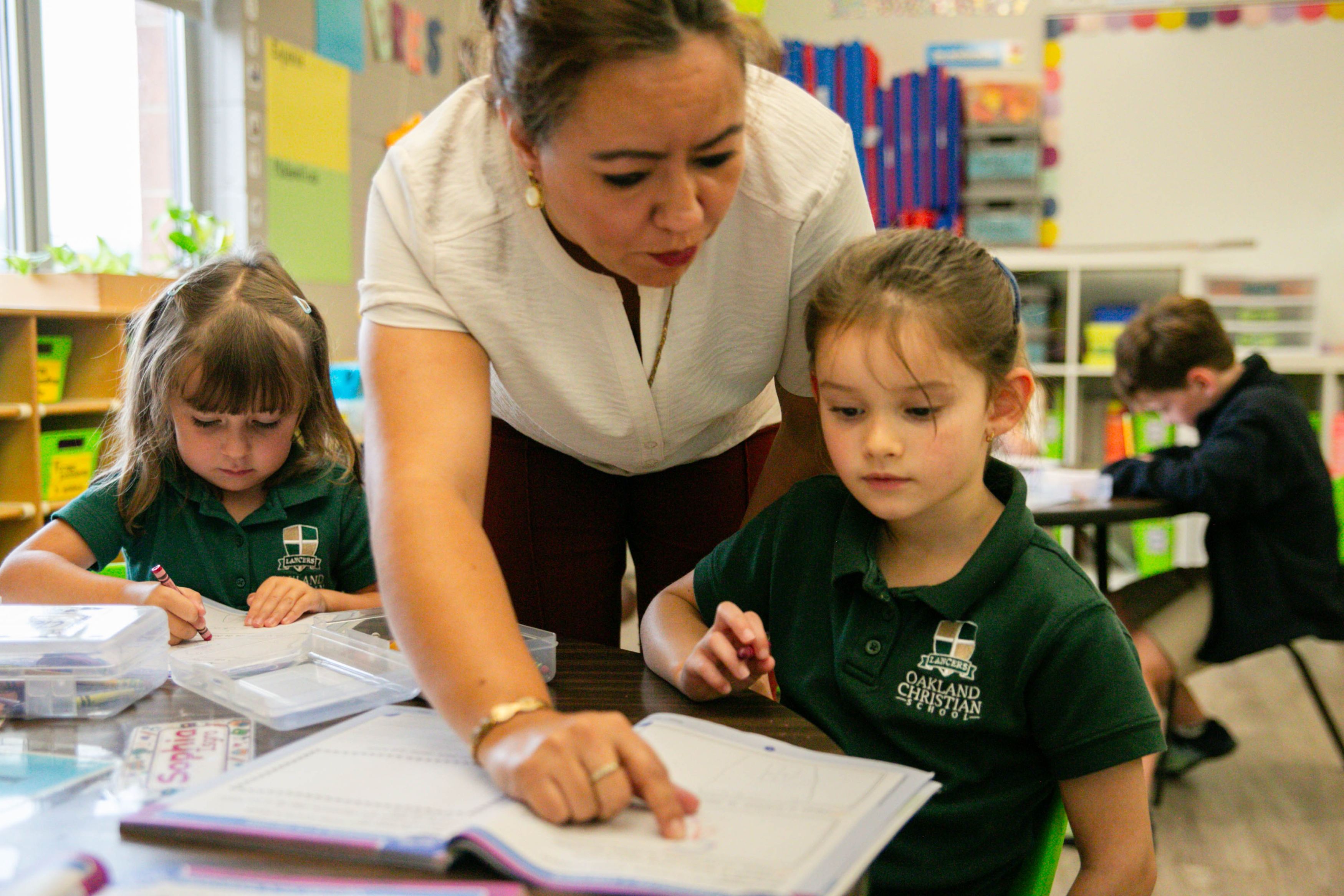 Oakland Christian Spanish Immersion Kindergarten students work with their teacher